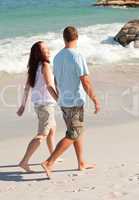 Lovers walking on the beach
