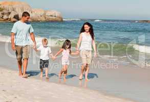 Family walking on the beach