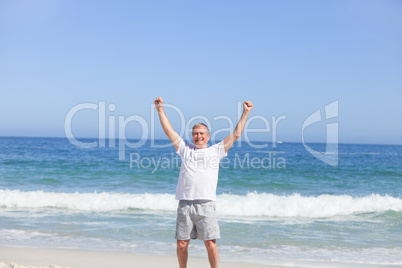 Man doing his stretches on the beach