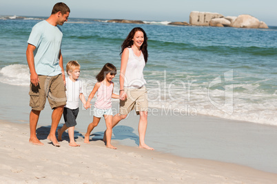 Family walking on the beach