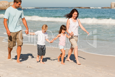 Family walking on the beach