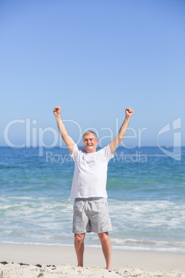 Man doing his stretches on the beach