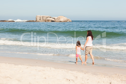 Mother and her daughter on the beach