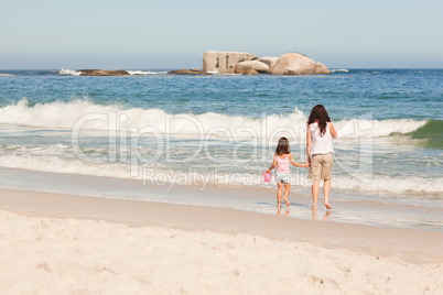 Mother and her daughter on the beach