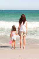 Mother and her daughter on the beach