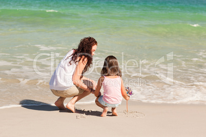 Mother and her daughter on the beach