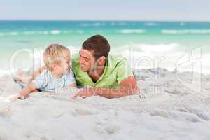 Happy father with his son at the beach