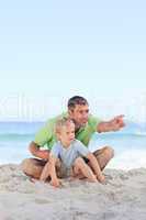 Happy father with his son at the beach