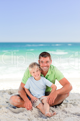 Attentive father with his son at the beach