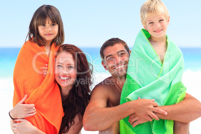 Parents with their children in towels