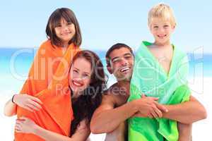Parents with their children in towels