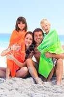 Parents with their children in towels