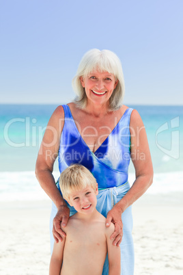 Grandmother with her grandson at the beach