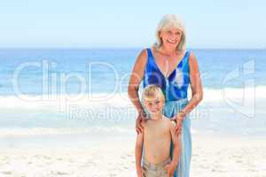 Grandmother with her grandson at the beach