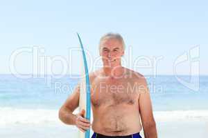 Retired  man with his surfboard