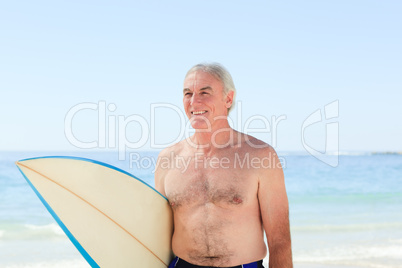 Retired  man with his surfboard