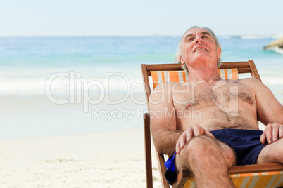 Man lying down in his deck chair