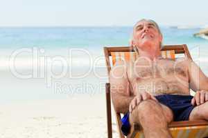 Man lying down in his deck chair