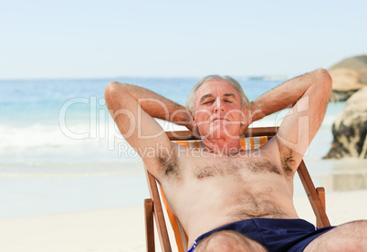 Man lying down in his deck chair