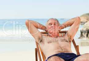 Man lying down in his deck chair