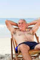 Man lying down in his deck chair