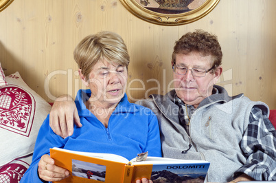 Senior Couple reading a Book, Italy