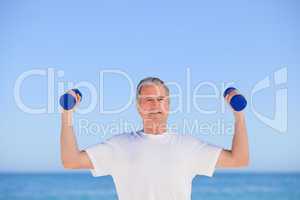 Mature man doing his exercises