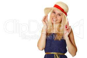 Beautiful young blond woman in a straw hat