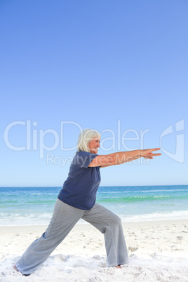 Retired woman doing her stretches