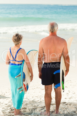 Couple with their surfboard on the beach