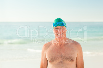 Smiling senior man at the beach