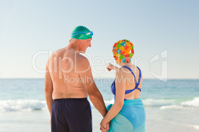 Enamored elderly couple at the beach
