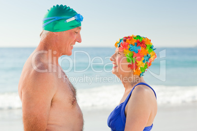 Enamored elderly couple at the beach
