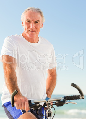 Senior man with his bike