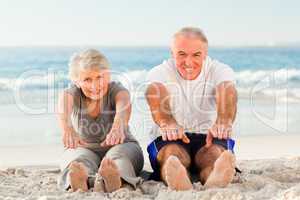 Couple doing their streches at the beach
