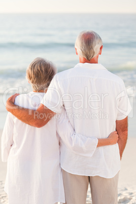 Man hugging his wife on the beach Man hugging his wife on the beach
