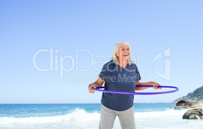 Senior  woman playing with her hoop