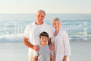 Grandparents with his grandson at the beach