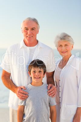 Grandparents with his grandson at the beach