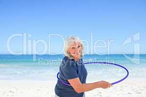 Senior woman playing with her hoop
