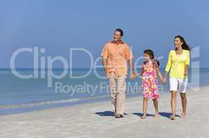 Happy Mother, Father and Daughter Family Walking on Beach