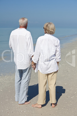 Happy Senior Couple Holdings Hands on A Tropical Beach