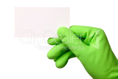 Hand in green glove showing business card