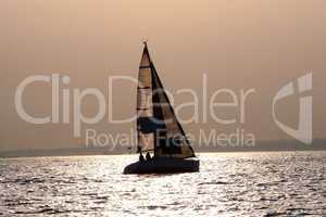 Sailing boatat sunset