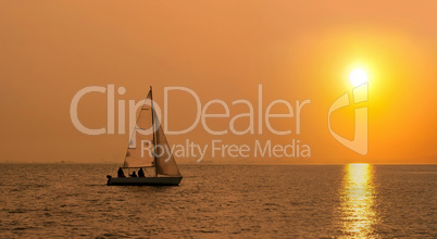 Sailing boat at sunset