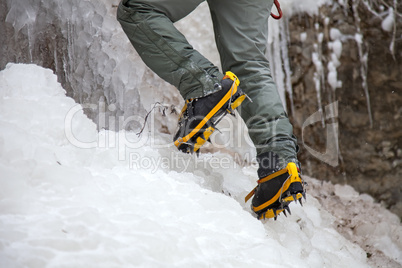 Pair of alpinist boots in crampons