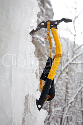 Climbing ice ax in the white ice