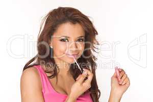 applying pink lipgloss