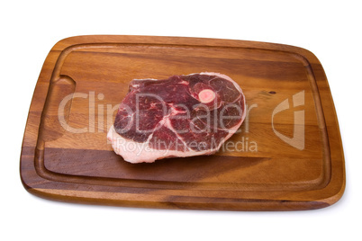 Raw meat on the wooden board