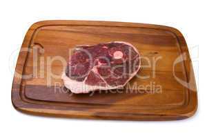Raw meat on the wooden board